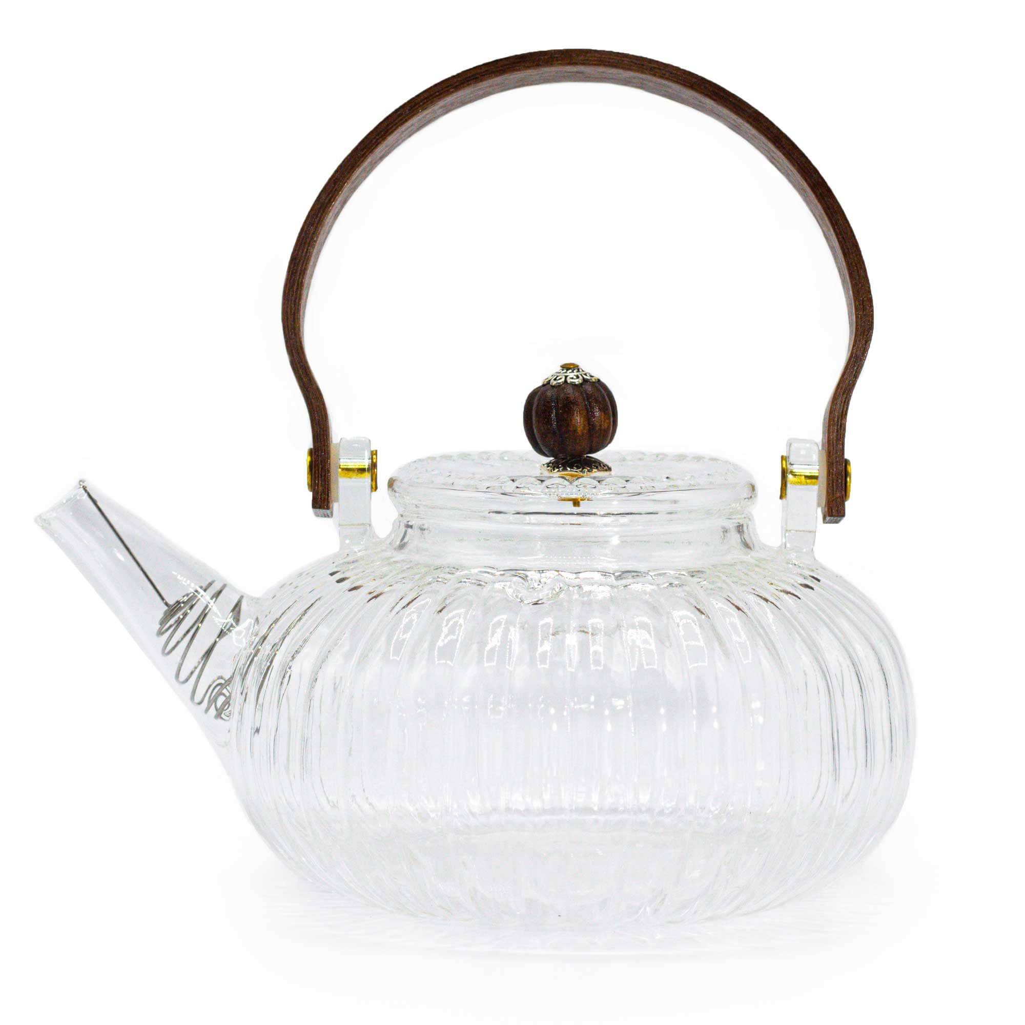 Clear glass teapot with a ribbed design, short spout, round wooden handle, and matching wooden knob on the lid.