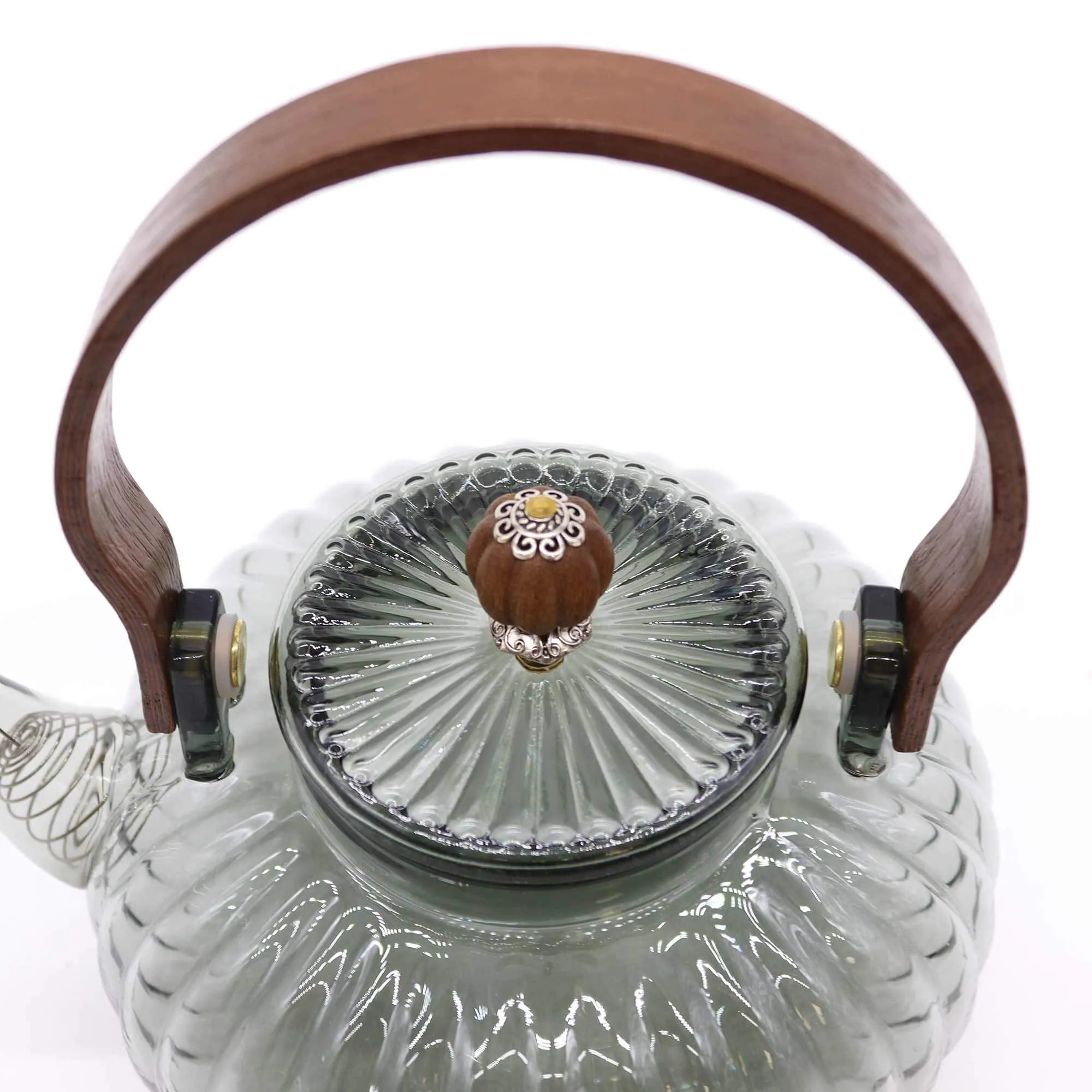 Clear glass teapot with a ribbed design, wooden handle, and a matching ribbed glass lid featuring a decorative wooden knob with a small floral detail.