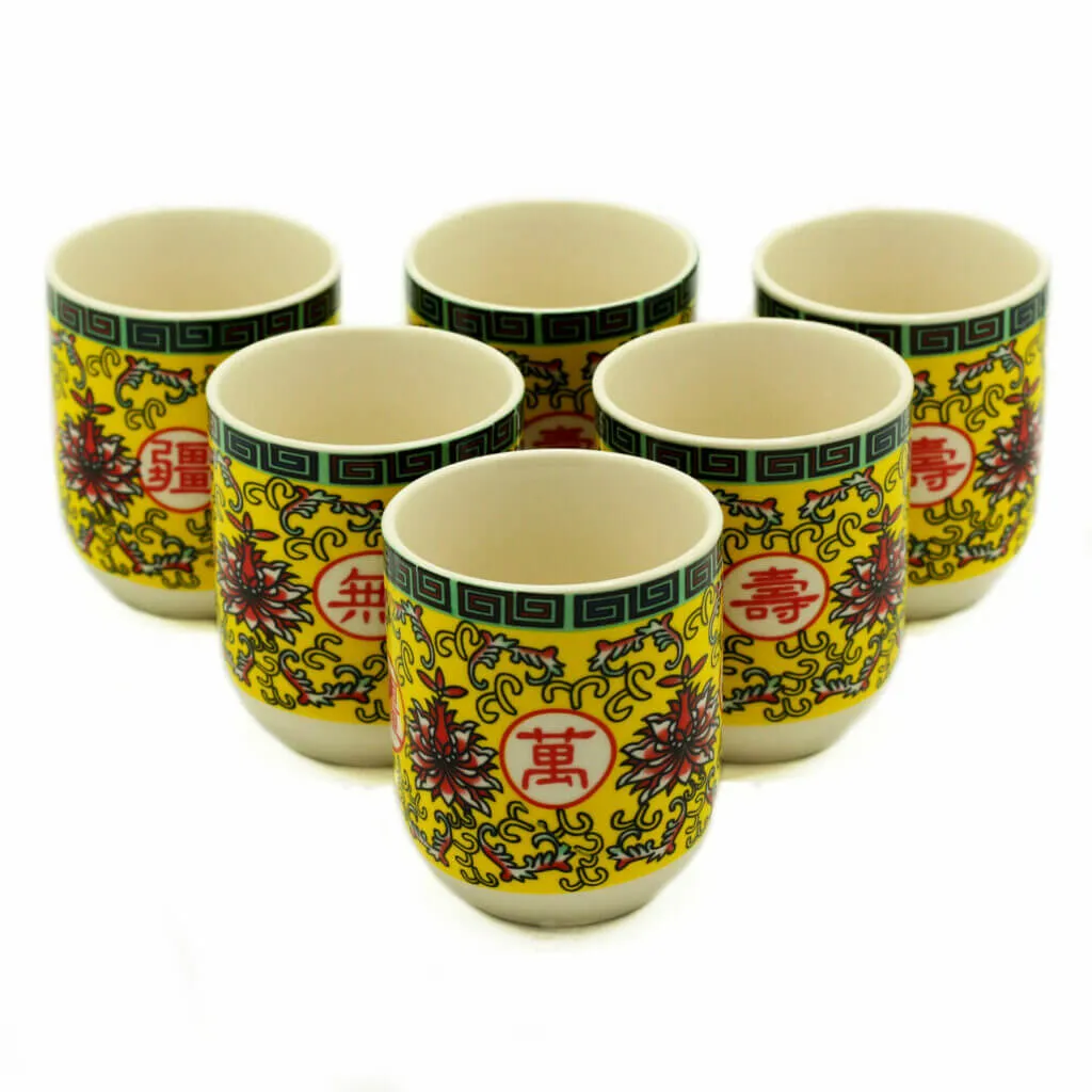 Six ornate yellow porcelain cups with red Chinese characters and floral designs, arranged in two rows on a white background.