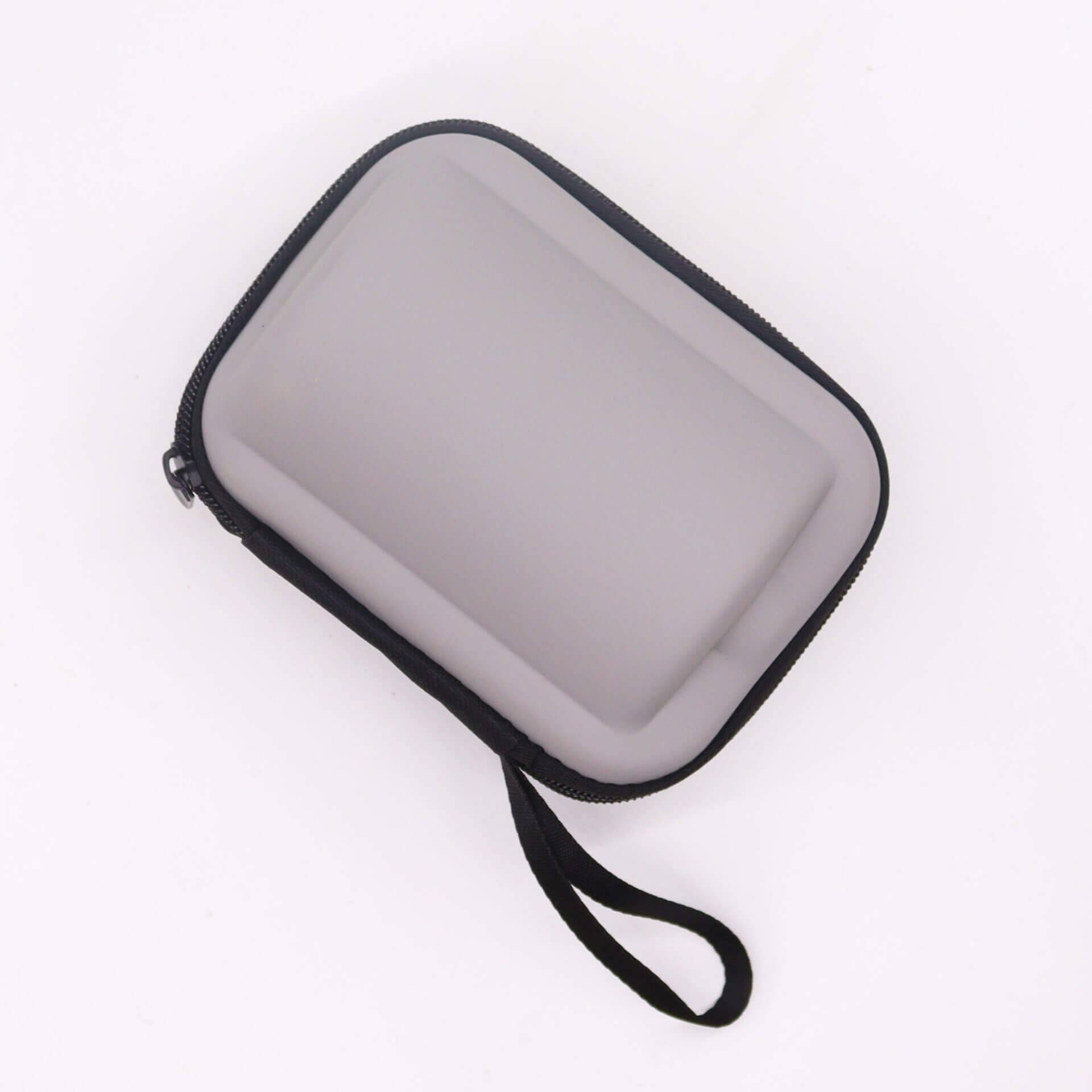 A small, rectangular, zippered carrying case with a wrist strap, shown on a white background.