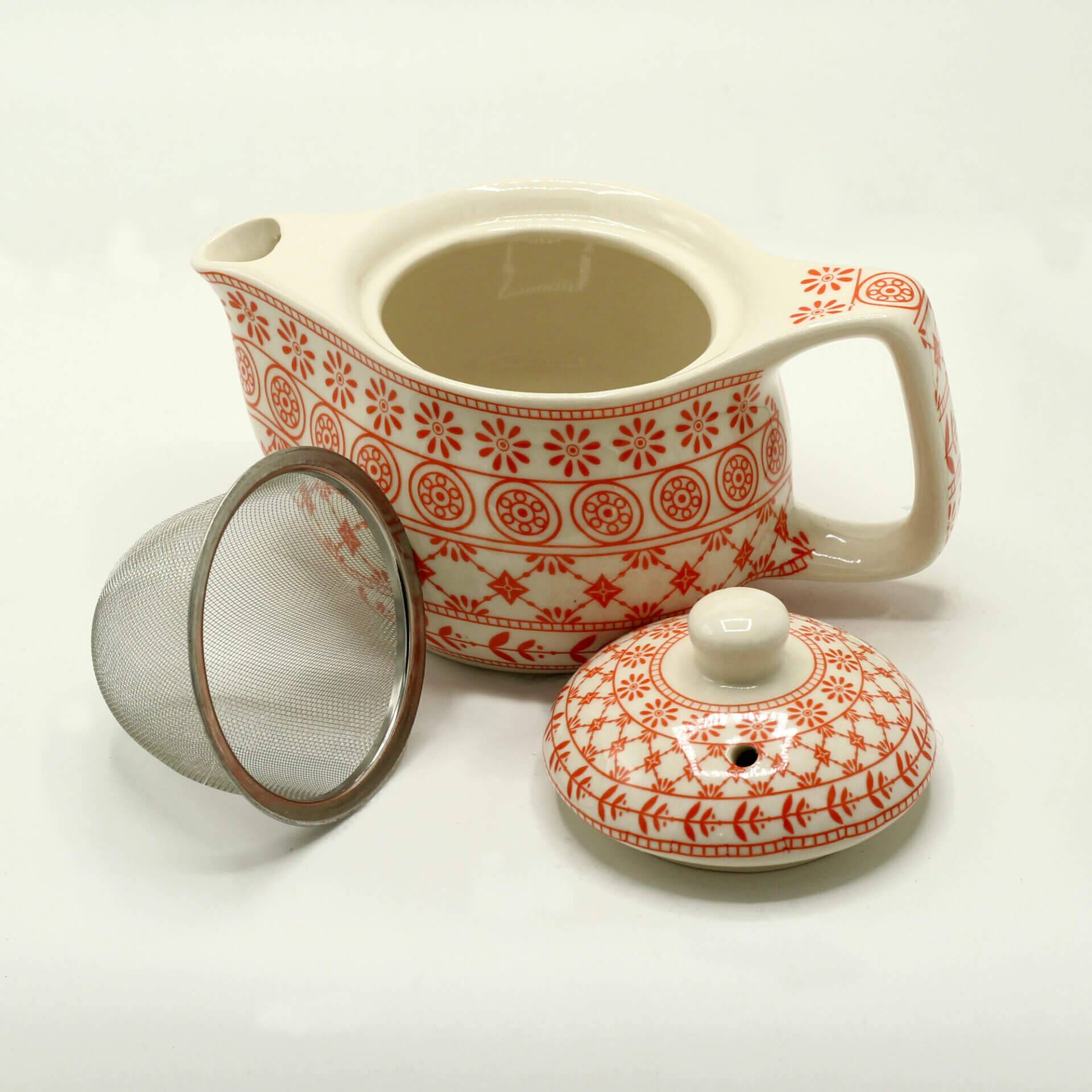 A patterned ceramic teapot with a matching lid and a metal mesh tea infuser, displayed on a plain white background.
