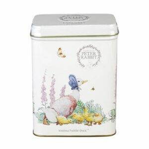 The Beatrix Potter - 40 Teabag Tin features illustrations of Jemima Puddle-Duck, ducklings, flowers, and a butterfly on a white background under "Peter Rabbit" branding. It's perfect for storing your favorite Earl Grey blend.