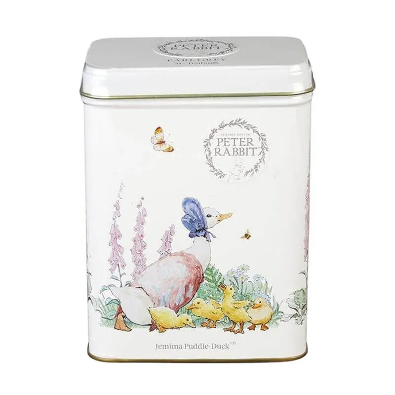 The Beatrix Potter - 40 Teabag Tin features illustrations of Jemima Puddle-Duck, ducklings, flowers, and a butterfly on a white background under 