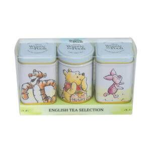 The Winnie The Pooh - Triple Mini Tin Gift Pack features charming designs of Tigger, Winnie the Pooh, and Piglet, labeled "English Tea Selection," beautifully arranged in a transparent gift box.
